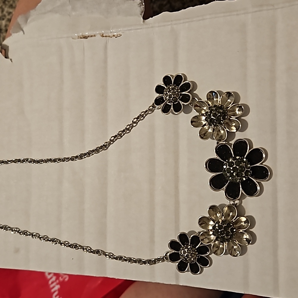Black and silver flower necklace. This would give a plan dress a new life.